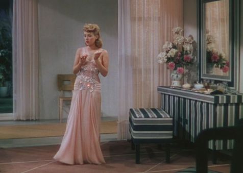 Lovely peach evening gown worn by Grable. (Comet Over Hollywood/Screen cap by Jessica P)